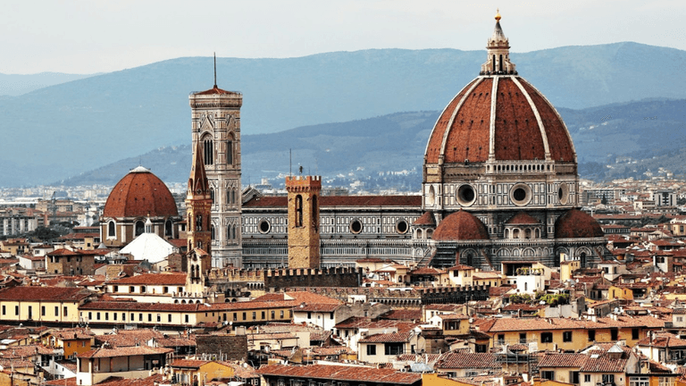 Florence's skyline featuring the iconic Florence Cathedral and surrounding rooftops.