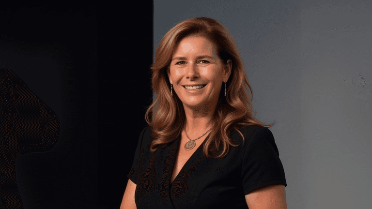 Helena Demuynck, founder of oxygen4leadership Ltd., smiling confidently in a professional portrait. She is a transformation catalyst dedicated to empowering women leaders by helping them lead authentically and break free from systemic limitations in corporate environments.