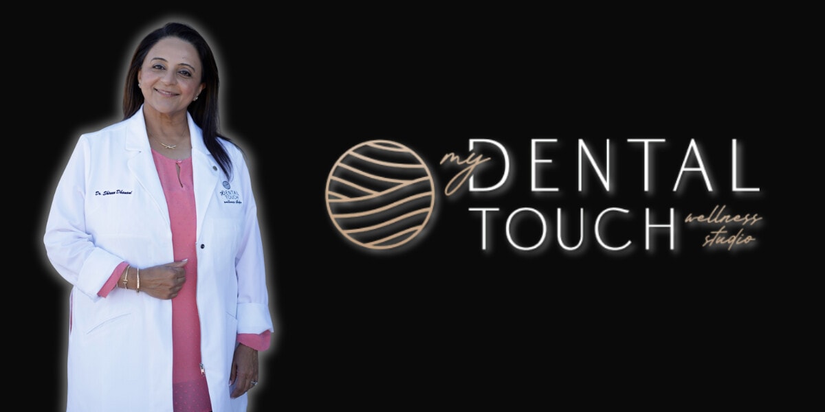DownloadDr. Shireen Dhanani, a dentist and wellness expert, standing in front of the My Dental Touch Wellness Studio logo.