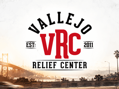 Logo for Vallejo Relief Center with a bridge and highway in the background