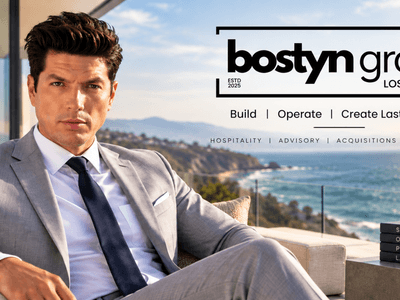 A man in a suit poses with a coastal view and text overlay for Bostyn Group.