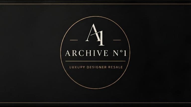 A black sign features a gold-bordered circle with "A1 ARCHIVE N°1" inside, and "Luxury Designer Resale" below, conveying elegance and exclusivity.