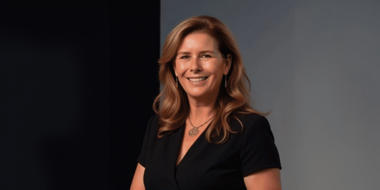 Helena Demuynck, founder of oxygen4leadership Ltd., smiling confidently in a professional portrait. She is a transformation catalyst dedicated to empowering women leaders by helping them lead authentically and break free from systemic limitations in corporate environments.