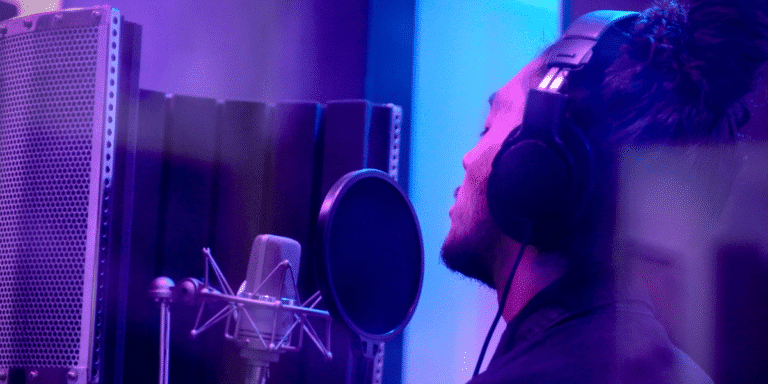 Almachize in the studio, blending music and business through creative expression.