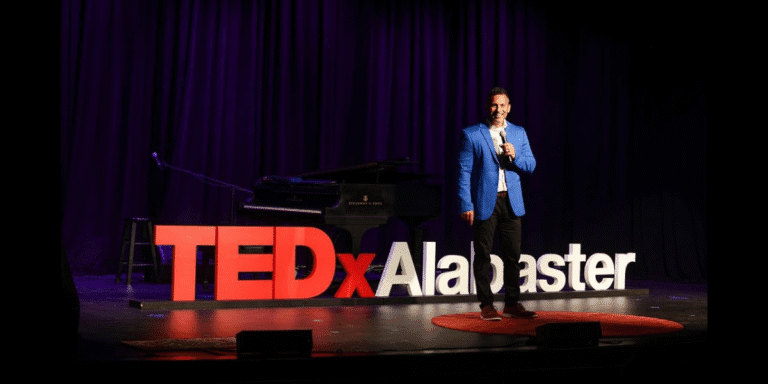 Brandon Matthews speaking on the TEDxAlabaster stage, highlighting his insights on AI’s role in enhancing human connection.