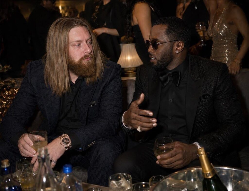 Sky Best sits speaking with another guest at a formal evening event.